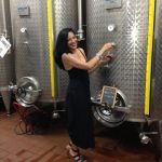 Woman in front of Wine Vats