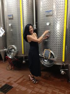 Woman in front of Wine Vats