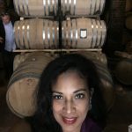 Selfie of a Woman with Wine Barrels